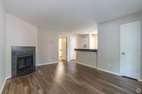 Cordova apartment for rent - a living room with a fireplace and wooden floors