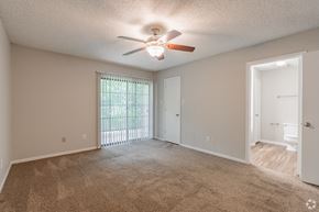 Cordova apartment for rent - a bedroom with a ceiling fan and a door to a closet