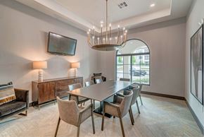 Fort Worth apartment for rent - A modern dining room with a large table and chairs.