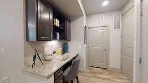 Katy apartment for rent - a home office with a desk and cabinets