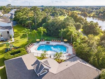 Resort-style pool with lounge seating