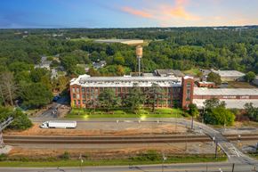 Spartanburg apartment for rent - an aerial view of a building with a water tower