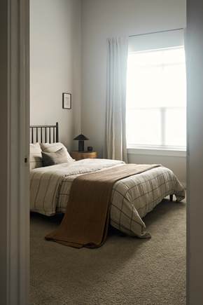 Nashville apartment for rent - A bedroom with a bed and a window.