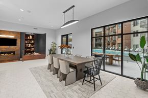 Austin apartment for rent - A modern dining room with a long table and chairs.