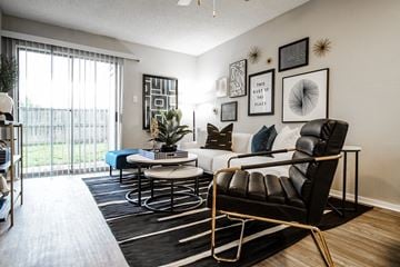 Austin apartment for rent - a living room with a white couch and a large window