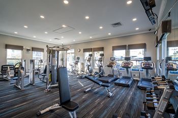 24-Hour fitness center with free weights & cardio area
