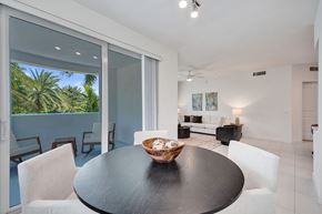 Boca Raton apartment for rent - A modern dining room with a table and chairs.