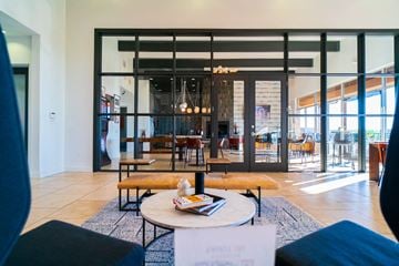 Austin apartment for rent - a living room with glass doors and a coffee table