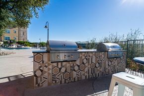 Austin apartment for rent - a grilling area with two grates and two bbqs