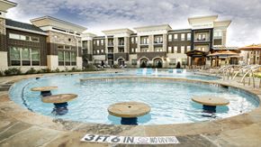 Mansfield apartment for rent - a large swimming pool in front of an apartment building