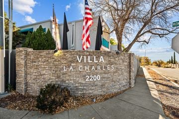 Albuquerque apartment for rent - A stone wall with the words VILLA LA CHARLES 2200 on it.