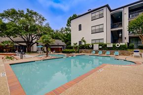 Dallas apartment for rent - the preserve at ballantyne commons pool and building with trees and buildings