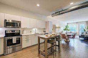 Tempe apartment for rent - A modern kitchen with a dining table and chairs.