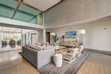 Tempe apartment for rent - A modern living room with a grey sofa and a wooden coffee table.