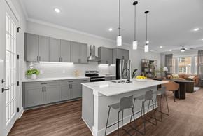 Gallatin townhouse for rent - A modern kitchen with a large island and bar stools.