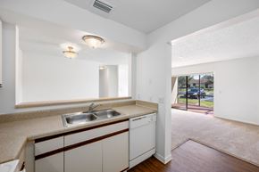 Palm Bay apartment for rent - A kitchen with white cabinets and a sink.
