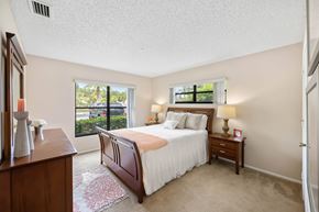 Port Saint Lucie apartment for rent - a bedroom with a bed and two windows