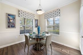 Ormond Beach apartment for rent - a dining room with a glass table and chairs