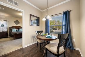 Savannah apartment for rent - A dining room with a table set for two and a view of the backyard.