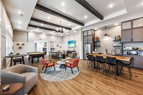 Fort Myers townhouse for rent - a clubhouse with a dining area and a kitchen with a table and chairs