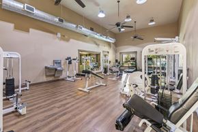 Albuquerque apartment for rent - A gym with a variety of equipment including weights and machines.