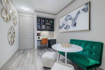 Houston apartment for rent - a living room with a green couch and a white table