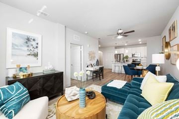 Davenport apartment for rent - A living room with a white couch and a blue couch.