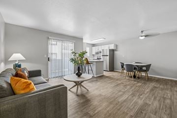 Las Vegas apartment for rent - A living room with a grey couch and a coffee table.