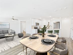 North Las Vegas apartment for rent - A modern dining room with a large table set for six.