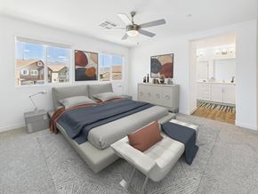 North Las Vegas apartment for rent - A bedroom with a bed, a chair, and a ceiling fan.