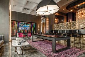 Las Vegas apartment for rent - a game room with a pool table and a colorful painting on the wall