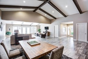 Sacramento apartment for rent - A large, modern dining room with a wooden table and chairs.