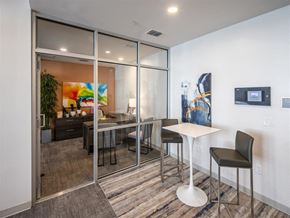 Tarpon Springs apartment for rent - a dining room with a table and chairs in front of a mirrored wall
