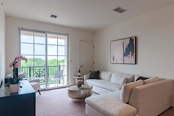 Lansdale apartment for rent - A living room with a large window and a painting on the wall.