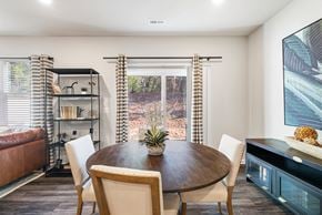 Concord townhouse for rent - A modern dining room with a wooden table and chairs.