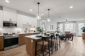 Mesa apartment for rent - A modern kitchen with wooden cabinets and a large island.