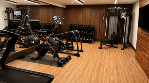 Jackson apartment for rent - A gym with a variety of equipment including treadmills, weights, and exercise machines.
