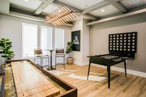 Las Vegas apartment for rent - A shiny pool table is in the middle of a room with a billiard table.