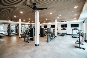 Greenwood apartment for rent - 24 hour fitness center with treadmills, weight benches, and