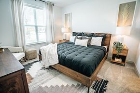 Greenwood apartment for rent - primary bedroom with large bed