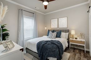 Huntsville apartment for rent - a bedroom with a large bed and a window