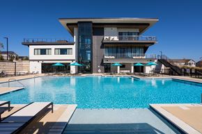Huntsville apartment for rent - A modern house with a pool in front.