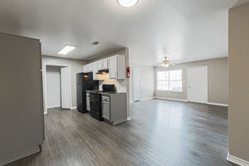Luxury vinyl wood plank flooring throughout the home and carpet in bedrooms