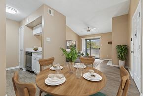 Austin apartment for rent - A dining room with a table set for two with a view of the backyard.