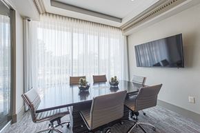 Houston apartment for rent - A conference room with a large table and chairs.