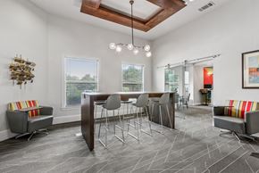 Austin apartment for rent - A modern dining room with a wooden table and grey chairs.