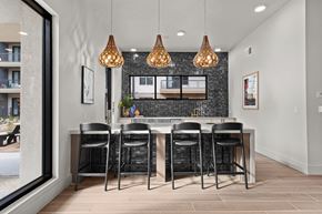 Austin apartment for rent - A kitchen with a black countertop and white cabinets.