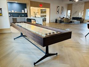 Las Vegas apartment for rent - A shiny pool table in the middle of a room.