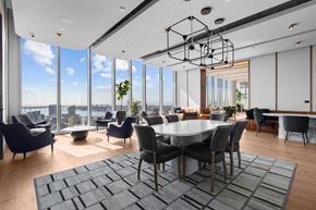 San Diego apartment for rent - A modern dining room with a large table and chairs.