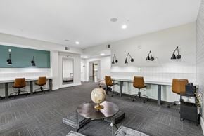 Waco apartment for rent - A conference room with a table, chairs, and a globe on the table.